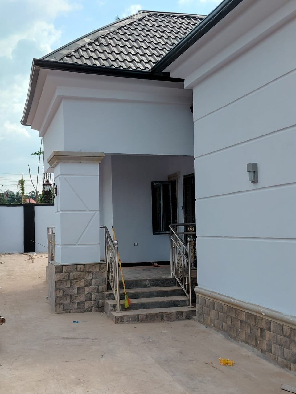 Completed bungalow entrance porch with stone cladding